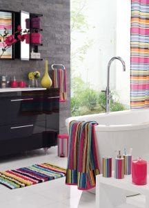 Bright towels and accessories can help breathe life into a dated bathroom.